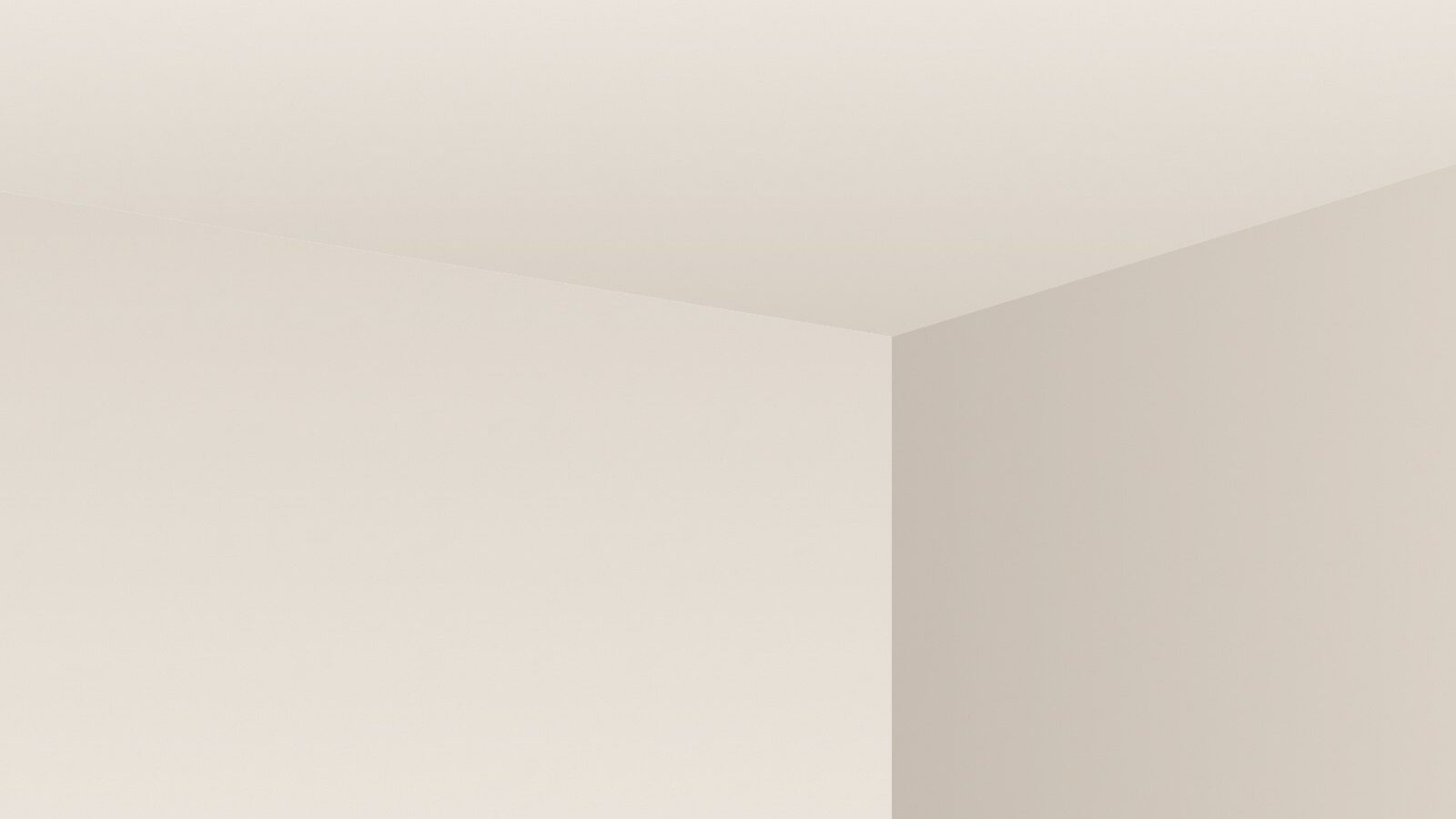 Hoek van een kamer met strak gestuukt plafond en wanden