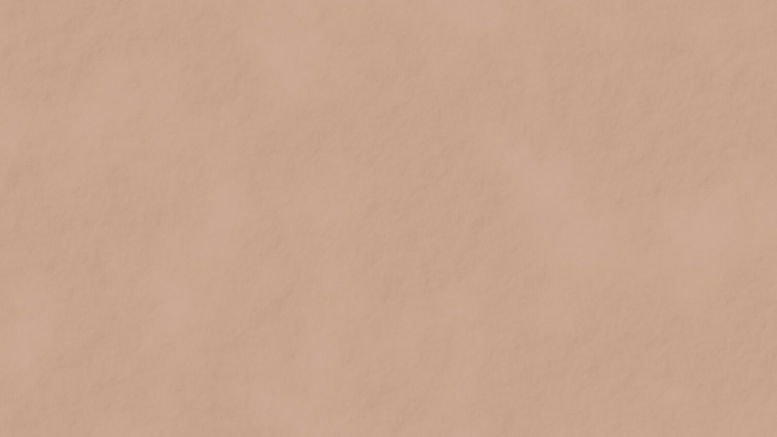 Wand met kalkstuc in een warme terracottatint